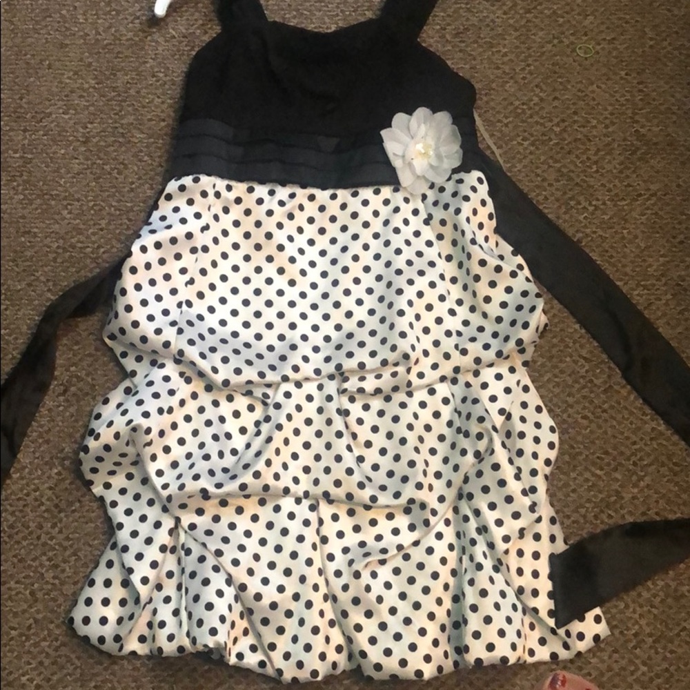 Black and dotted red and white dress with flower